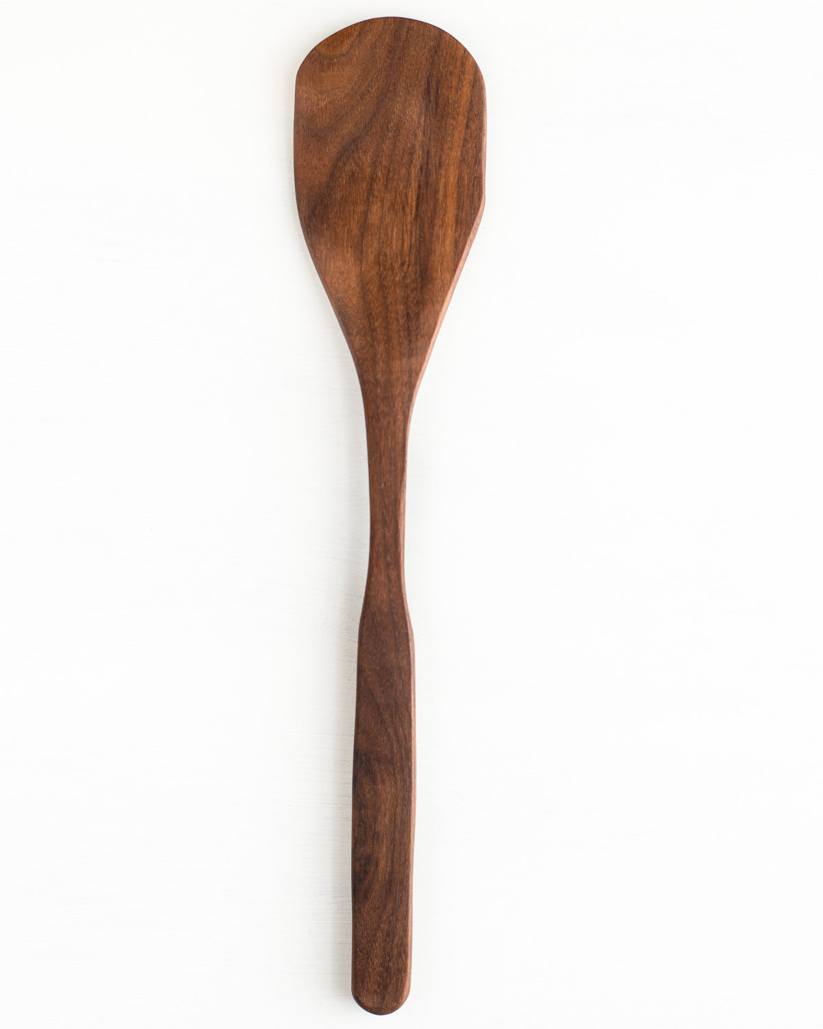 The curved sides of this wooden spatula, along with the long handle help you get into tight spots easily in tall pans and deep bowls.