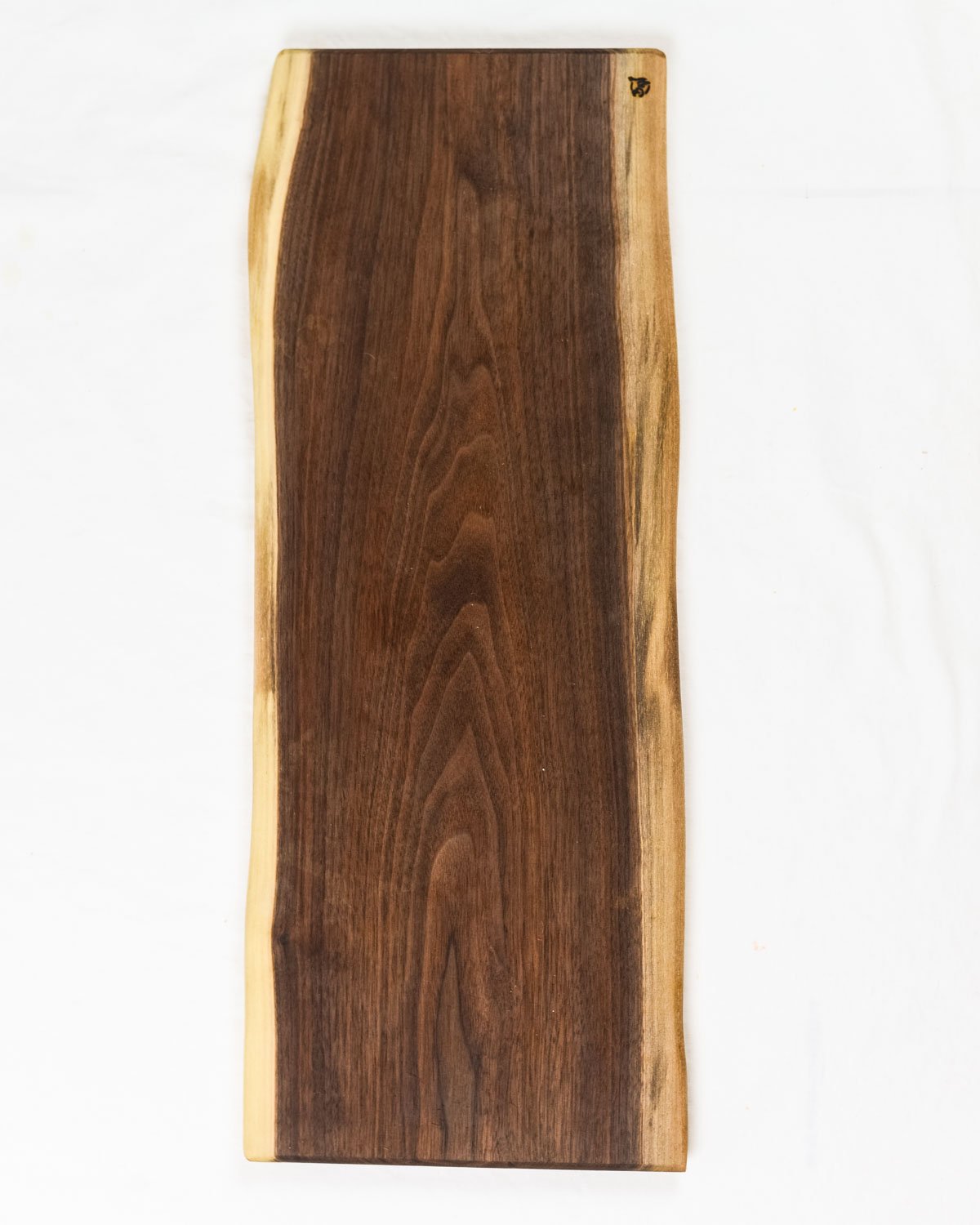 These Walnut Live Edge Serving Trays are the perfect choice when serving your favorite charcuterie on a beautiful wood tray. Each piece is unique, showing the grain patterns to create true art straight from nature.